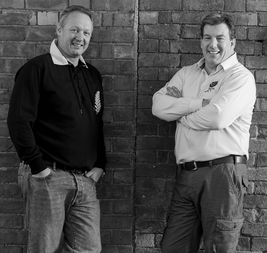 Black and white photo of company owners