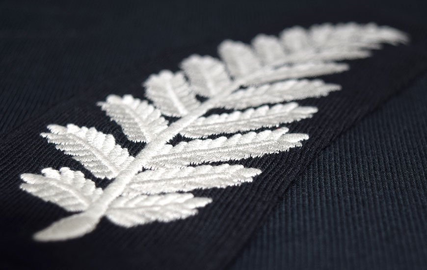Close up of New Zealand fern embroidered badge