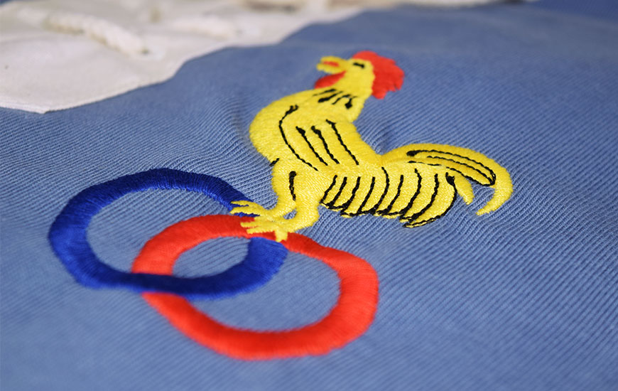 Close up of French rooster embroidered badge