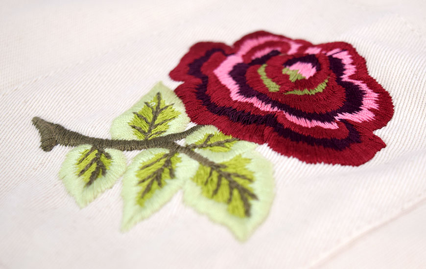 Close up of English rose embroidered badge